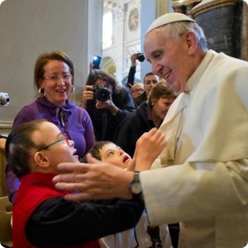 Pope Francis greeting two young boys